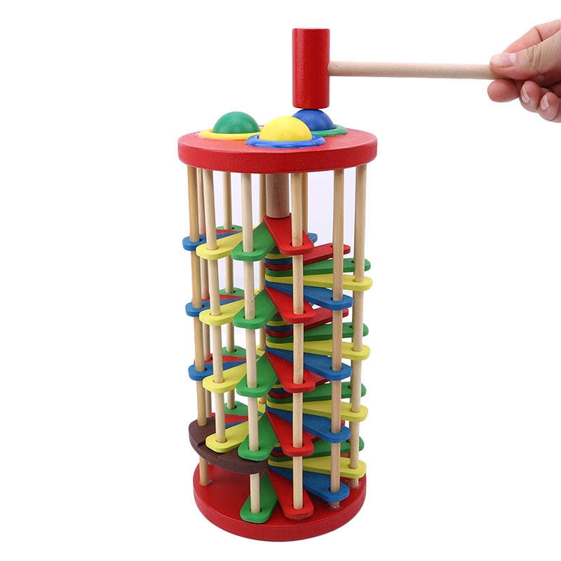 Pound And Roll Wooden Tower With Hammer Knock The Ball